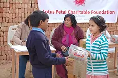 Students Receive Shoes, Caps, and Socks